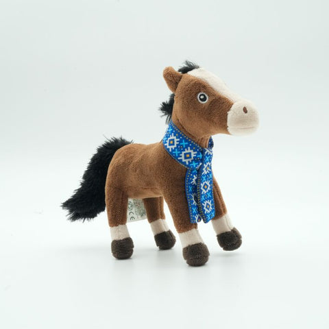 A brown plush toy horse with a black mane and tail, white facial markings and lower legs, wearing a blue patterned scarf, photographed on a seamless white background.